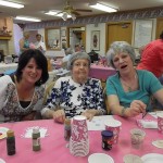 Family enjoying their time together while painting flower pots for spring.